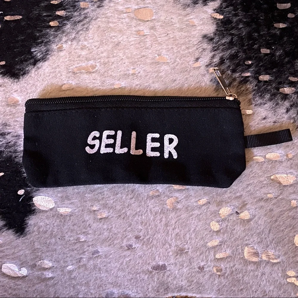 Black Canvas Zipper Pouch with “Seller” Graphic On One Side